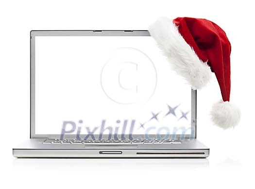 Laptop with santas hat on a white background Laptop with santas hat on a white background