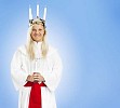 Girl on a St. Lucys day on a blue background
