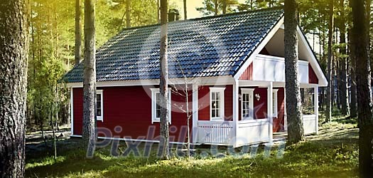 A house in the forest on a sunny day A house in the forest on a sunny day