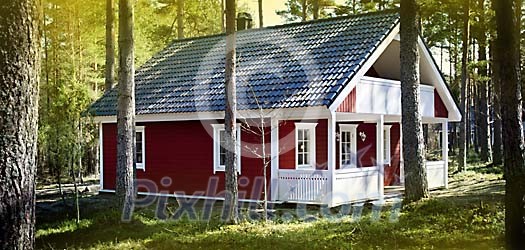 A house in the forest on a sunny day