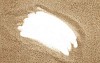 Hole in the sand background