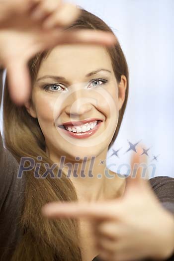 Girl making a frame with fingers Girl making a frame with fingers