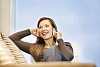 Woman on the couch talking to a phone