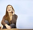 Woman sitting and talking on the phone