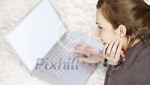 Woman on the floor with laptop Woman on the floor with laptop