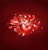 Red hearts flying towards camera