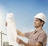 Man checking the plans at the building site