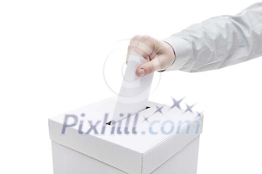 Clipped hand putting a vote in to the box Clipped hand putting a vote in to the box