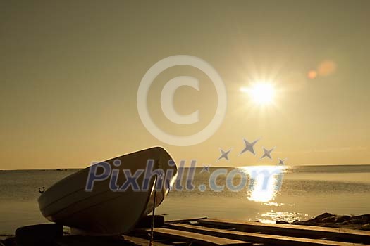 Boat on the pier at the sunset