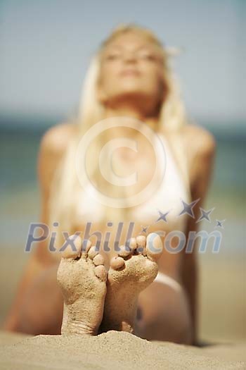 Woman sun tanning at the beach Woman sun tanning at the beach