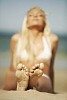 Woman sun tanning at the beach