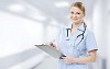 Female nurse writing down notes