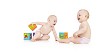 Twin babies playing