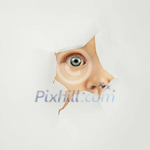 Baby peeking behind a hole in paper Baby peeking behind a hole in paper