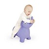 Baby girl sitting on a toy elephant