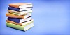 Pile of books on a blue background