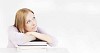 Woman sitting and thinking on books