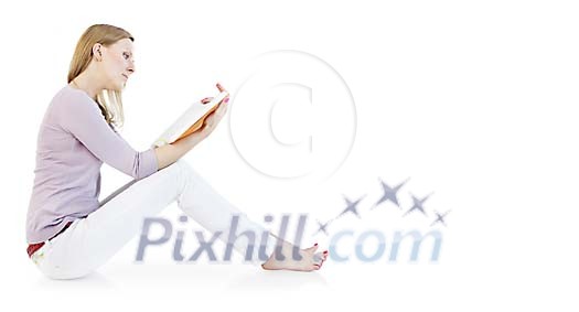 Woman sitting on the floor and reading Woman sitting on the floor and reading