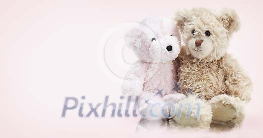 Two teddy bears sitting together Two teddy bears sitting together