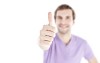 20-30 year old man showing thumbs up, focus on thumb