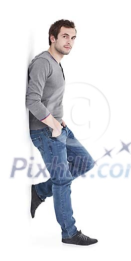 Casually dressed man leaning to the wall Casually dressed man leaning to the wall