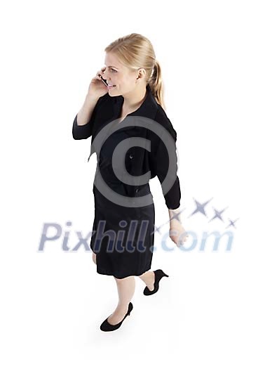 Clipped businesswoman walking and talking to her phone Clipped businesswoman walking and talking to her phone