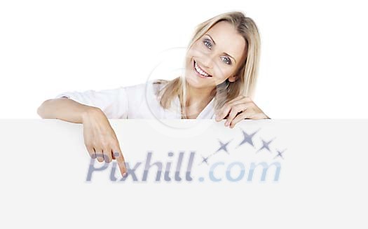 Beautiful woman holding and pointing to a blank sign Beautiful woman holding and pointing to a blank sign