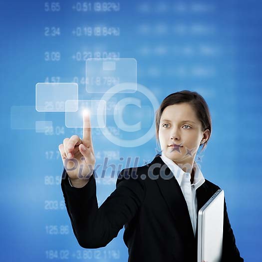 Businesswoman touching a virtual touchscreen Businesswoman touching a virtual touchscreen