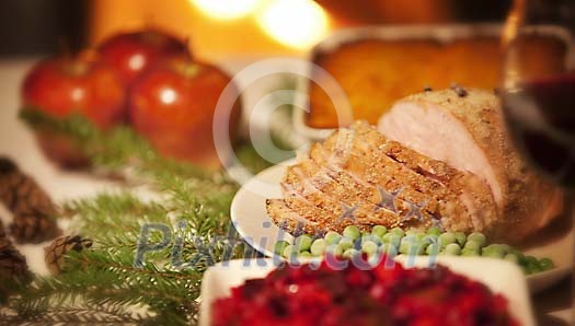 Sliced ham on a decorated christmas table Sliced ham on a decorated christmas table