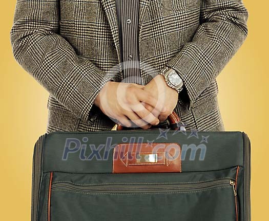 Man holding his bag by the handle Man holding his bag by the handle