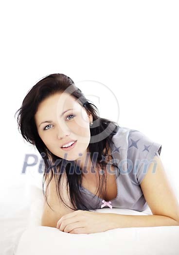 Woman in the bed looking straight to the camera Woman in the bed looking straight to the camera