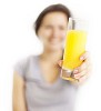 Defocused woman offering glass of juice