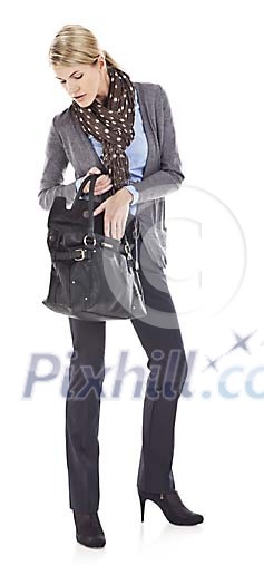 Isolated businesswoman looking for someting from her bag Isolated businesswoman looking for someting from her bag