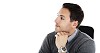 Isolated man sitting sideways