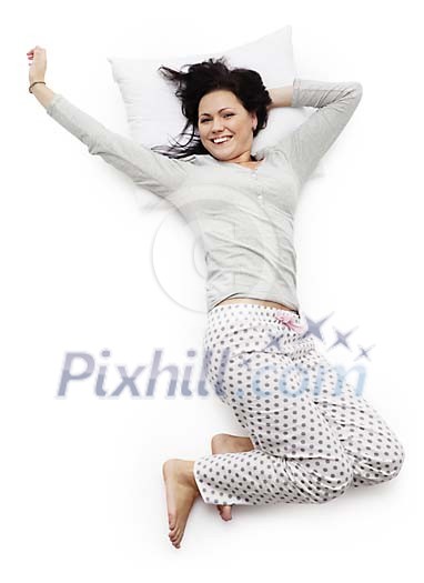 Woman stretching and smiling in the bed