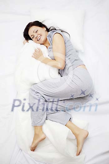 Woman smiling from the bed