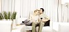 Couple enjoying wine on the sofa