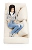 Woman on the couch, reading e-book