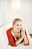 Woman on the couch smiling to the camera