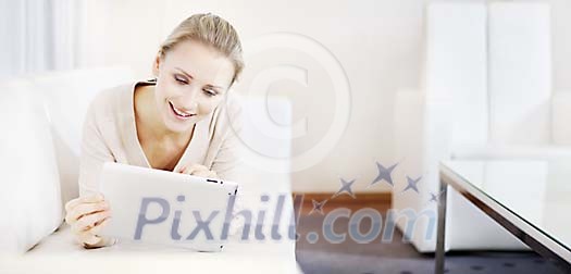 Woman on the couch with tablet Woman on the couch with tablet