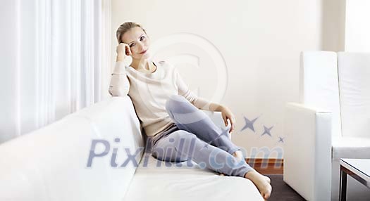 Woamn sitting on the sofa Woamn sitting on the sofa