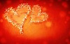 Two lighted hearts on a red background
