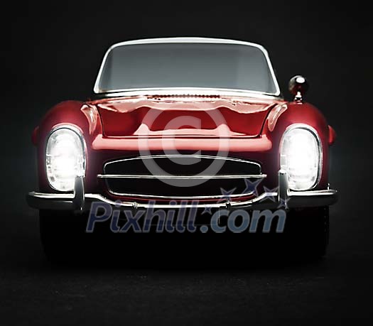 Front of the vintage car on a black background Front of the vintage car on a black background