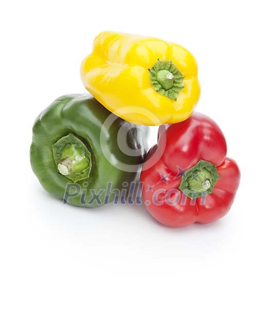 Isolated different coloured paprikas Isolated different coloured paprikas