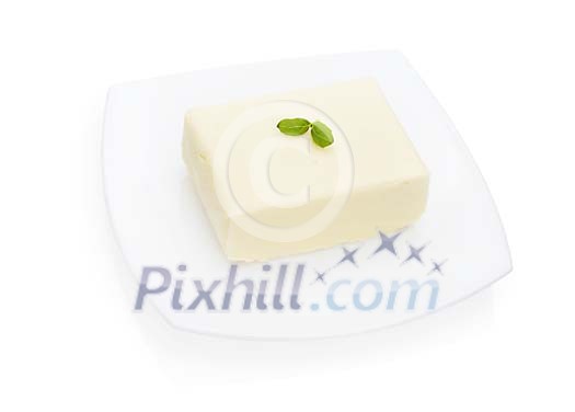 Isolated butter on a plate Isolated butter on a plate