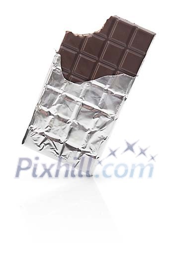 Isolated chocolate bar, corner bitten off Isolated chocolate bar, corner bitten off