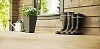 Boots and flowers on the porch