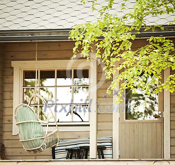 Swing on the cottage porch Swing on the cottage porch