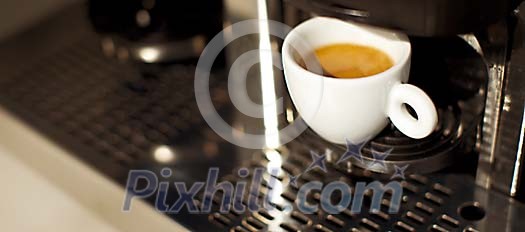 Cup of coffee on the machine Cup of coffee on the machine