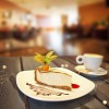 Slice of cake and cup of coffee on the table